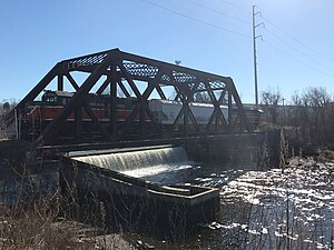 Train crossing Omega Pond Railroad Bridge