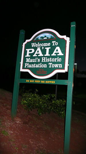 Signs welcoming visitor the Paia, Maui. Under ...