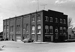 Photo of a boxy brick building