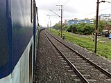 19132 Kutch Express at a curve outside Surat