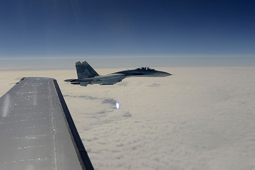 A Russian Air Force Su-27 Sukhois aircraft intercepts a simulated hijacked aircraft, foreground, during Vigilant Eagle 2013 at Joint Base Elmendorf-Richardson, Alaska, Aug. 27, 2013 130827-F-XT249-155