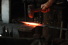 Hot metal work from a blacksmith Blacksmith working.jpg