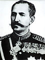 Constantin Poenaru wearing a grand officer's cross, military version with crossed swords.