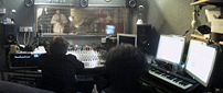 Photo of a recording studio control room during recording, viewing a trumpet part performance in the the studio room, for Witches' Heart of Stone album - http://www.witchesband.