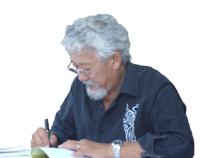 Suzuki signing a copy of his works.