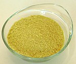 Nutritional yeast flakes are yellow in colour Hefeflocken Naturata.jpg