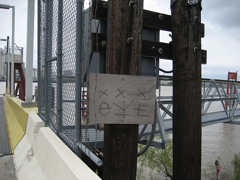 Hobo or tramp markings at Algiers entrance to Canal Street Ferry across Mississippi River, New Orleans.