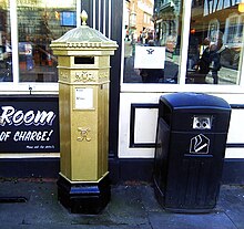 The Gold Victorian-style Penfold post box in Lincoln painted in recognition of Paralympian Sophie Wells who won the gold medal in the team Equestrian event at the 2012 Paralympic Games in London. It is the only post box painted gold in the county Lincoln Gold Postbox.jpg