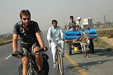 Mark Beaumont riding his bike.
