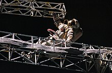 Cosmonaut Alexander Serebrov sets up an integrated truss structure "Rapana" at Mir space station, September 16, 1993 Onufriyenko-Sofora-EVA.jpg