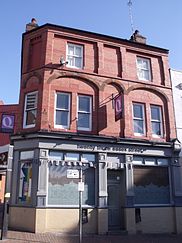 A portrait image of the Queens Tavern in the Birmingham Gay Village