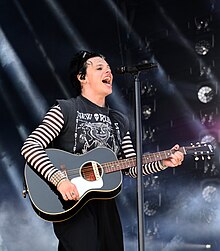 Androgynous outfit worn by alternative singer Yungblud in 2023 Yungblud - Rock im Park 2023 23.jpg