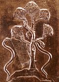 L18. Arbre avec deux serpents et une tête.