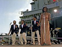 Gladys Knight & the Pips perform aboard the aircraft carrier USS Ranger on November 1, 1981. Left to right: William Guest, Edward Patten, Merald "Bubba" Knight, and Gladys Knight.