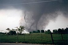 The infamous photograph of the 1997 Jarrell F5 tornado, nicknamed the "Dead Man Walking Tornado" due to its' sub-vortices appearing similar to the grim reaper walking. Dead Man Walking Jarrell 1997.jpg