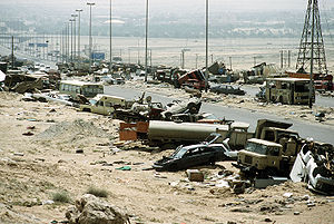Demolished vehicles line Highway 80, also know...