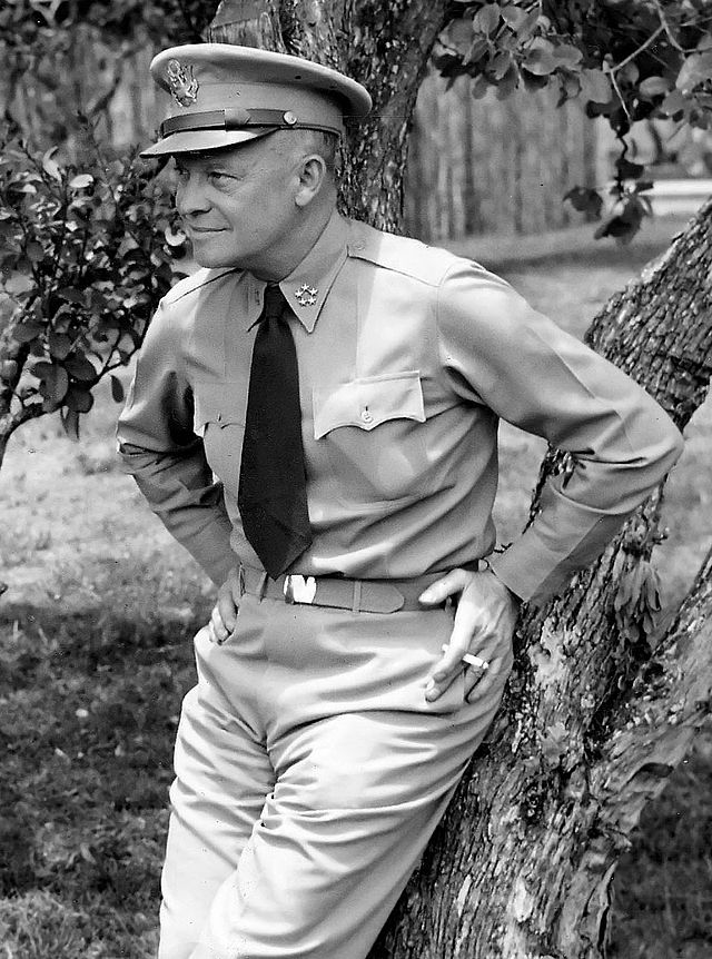 General Eisenhower in uniform showing the five star insignia of General of the Army on the corners of his collar.