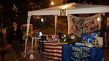 A cosplayer at a Comic Con in a Fallout-themed area Fallout Cosplayer Villa Carrara.jpg