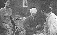 Ratna Asmara, Ali Joego, in bandages, and Iscandar Sukarno in a scene from Djaoeh Dimata (Option A)