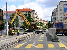 In 1994-2008, RFE/RL used the former Federal Parliament building of the abolished Czechoslovakia in Prague New Town. For many years after the 9/11 attacks in 2001 in the US, the building was protected by security concrete barriers. These reduced the capacity of the most frequented roads in Prague center. Vinohradska str, Prague Vinohrady.jpg