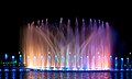 Wrocław Multimedia Fountain illuminated at night during a program