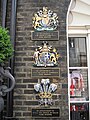 The Royal Warrants held by Ede & Ravenscroft displayed at their Burlington Gardens shop