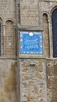 Vertical sundial on South Transept Wall Ely Cathedral hours.jpg