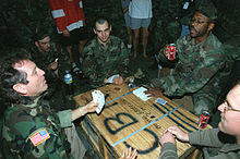 Gatlin (left) playing cards with Seabees in Croatia after a performance in 1995 Larry Gatlin playing cards in Croatia.JPEG