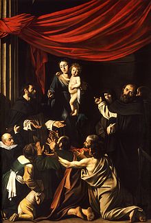 Peinture d'une Vierge à l'enfant, avec une foule de personnes à ses pieds en posture de prière.