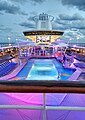 The Royal Caribbean MS Majesty of the Seas pool deck at sunset