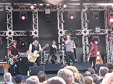 The New York Dolls, performing at the Burlington Sound of Music festival in 2010 New York Dolls.jpg