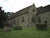 Part of a stone church, showing the nave on the left and part of the chancel to the right