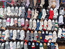 Photo of a sock store displaying a variety of colorful socks