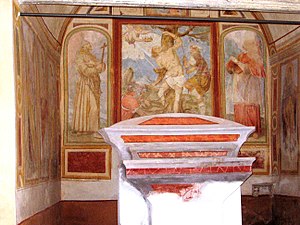 San Sebastiano. Ciclo pittorico del XVII secolo. Parete di fondo. San Sebastiano tra i Santi Francesco d'Assisi e San Carlo Borromeo.