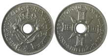 A New Guinean one-shilling coin, 1935 1 shilling Guinea thuoc Uc 1935.png