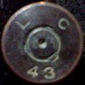 Headstamp of a .50 caliber bullet casing made at the Lake City Army Ammunition Plant in 1943.