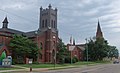 First Reformed Church,(now First Church of the Resurrection), 901 E. Tuscarawas St., Canton Ohio on left and First Lutheran Church, 909 E. Tuscarawas St., Canton Ohio on right, behind tree.