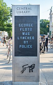 Protesters placed a stencil over the Central Brooklyn Public Library digital sign which reads "George Floyd was lynched by police" George Floyd rally in Grand Army Plaza (02933).jpg