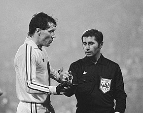 Footballer Jim McDonagh and a referee
