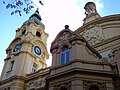 Another angle of the facade, with the clock tower in the background.