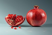 Pomegranate fruit - whole and piece with arils Pomegranate fruit - whole and piece with arils.jpg