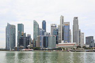 The skyline of a city, showing many tall buildings near a body of water