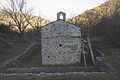 The church surrounded by low walls.