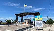 Ukrainian checkpoint at Kalanchak, entering Kherson Oblast from Russian-occupied Crimea. Ukrainian checkpoint for the de facto border between Kherson and Russian-occupied Crimea.jpg