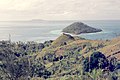 Patchwork of vegetation in foreground, looking past Yanuyanu Island across the huge lagoon towards Cikobia-i-Lau in the distance