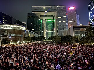 Protesters raised their hands with their palms as they chanted the slogan "five demands, not one less".