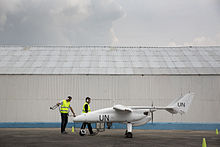 A UAV in Goma as part of MONUSCO peacekeeping mission A team of technicians prepares for the inaugural flight of an Unmanned-Unarmed Aerial Vehicles (UAV) in Goma, North Kivu province (11189522286).jpg