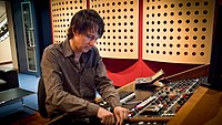 A studio engineer working with an audio mixer in a recording studio Ben Feggans.jpg