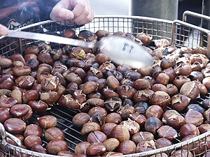 Roasted chestnuts being sold by street vendor