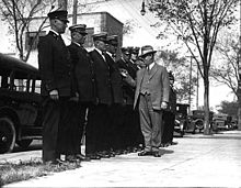 Chief Frank W. Brunskill inspecting officers at Station Number 5 in 1925. Brunskill was also at the heart of Supreme Court case Near v. Minnesota involving Minnesota's Gag Law. Chiefbrunskill.jpg